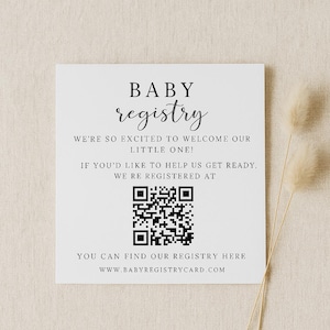 May include: A white square card with the words "BABY registry" in elegant script. The card includes text inviting guests to help prepare for a new baby, a QR code, and the website www.babyregistrycard.com.