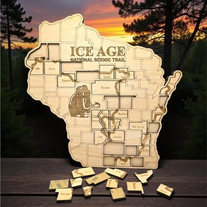 May include: Wooden puzzle in the shape of Wisconsin with the text "ICE AGE NATIONAL SCENIC TRAIL". The puzzle includes county names and a mammoth illustration. Several puzzle pieces are scattered below.