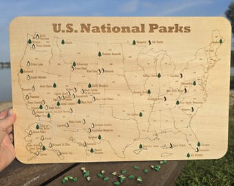 National Parks Travel Tracking Map of the United States with tree cutouts to mark the parks you've visited. Hiking traveling wall decor sign