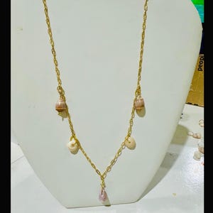 16 “dainty hawaiian cone shell and puka shell  necklace.