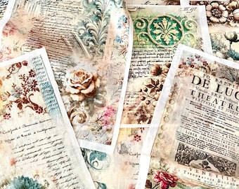 May include: A collection of vintage-style paper sheets with floral and script designs. The papers feature roses, hydrangeas, and other flowers in shades of pink, blue, and brown. Some sheets have text from old books.