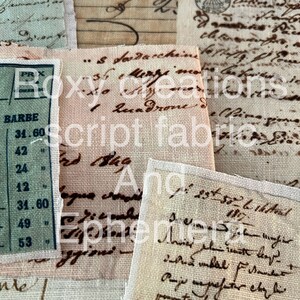 May include: A collection of vintage fabric scraps with handwritten text in brown ink. The fabric is a light beige color with a subtle texture. The text includes the words "Roxy Creations", "Script Fabric", and "Ephemera".