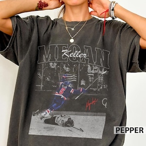 Camisa clásica de hockey Megan Keller, campeona de EE. UU., con colores cómodos