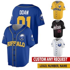 May include: A collection of baseball jerseys in various colors, including blue, yellow, black, and white. The jerseys feature team logos, player names, and numbers. The text "BUFFALO", "Sabres", and "DOAN" are visible. The image also includes the text "CUSTOM ANY REQUEST" and "LOGO, NUMBER, NAME".