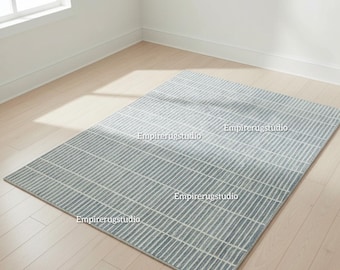 Handtuftad ljusblå elfenbensfärgad matta i modern rektangulär stil, minimalistisk geometrisk design, handgjord vardagsrumsmatta i skandinavisk stil