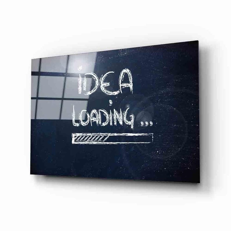 May include: A dark blue background with white chalk-like text that reads "IDEA LOADING..." with a progress bar underneath.