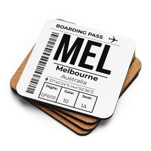 May include: A square cork coaster featuring a white top surface printed with a black boarding pass design for Melbourne, Australia. The text includes MEL, Melbourne, Australia, coordinates 37°40'24"S 144°50'36"E, flight QF600, gate 10, and seat 1A.