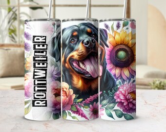 May include: A stainless steel tumbler featuring a Rottweiler dog portrait with a floral design. The tumbler has a white background with the word "ROTTWEILER" in black vertical text. The design includes sunflowers and pink flowers.