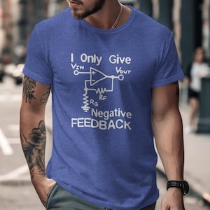 May include: A blue t-shirt with a white graphic of an electrical circuit diagram and the text "I Only Give Negative Feedback".