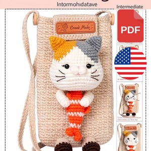May include: A beige crochet crossbody bag featuring a cat character with a white face, orange and grey ears, and black whiskers. The cat holds an orange and white striped fish. A brown leather-like label reads Crood Made. Includes a PDF pattern.