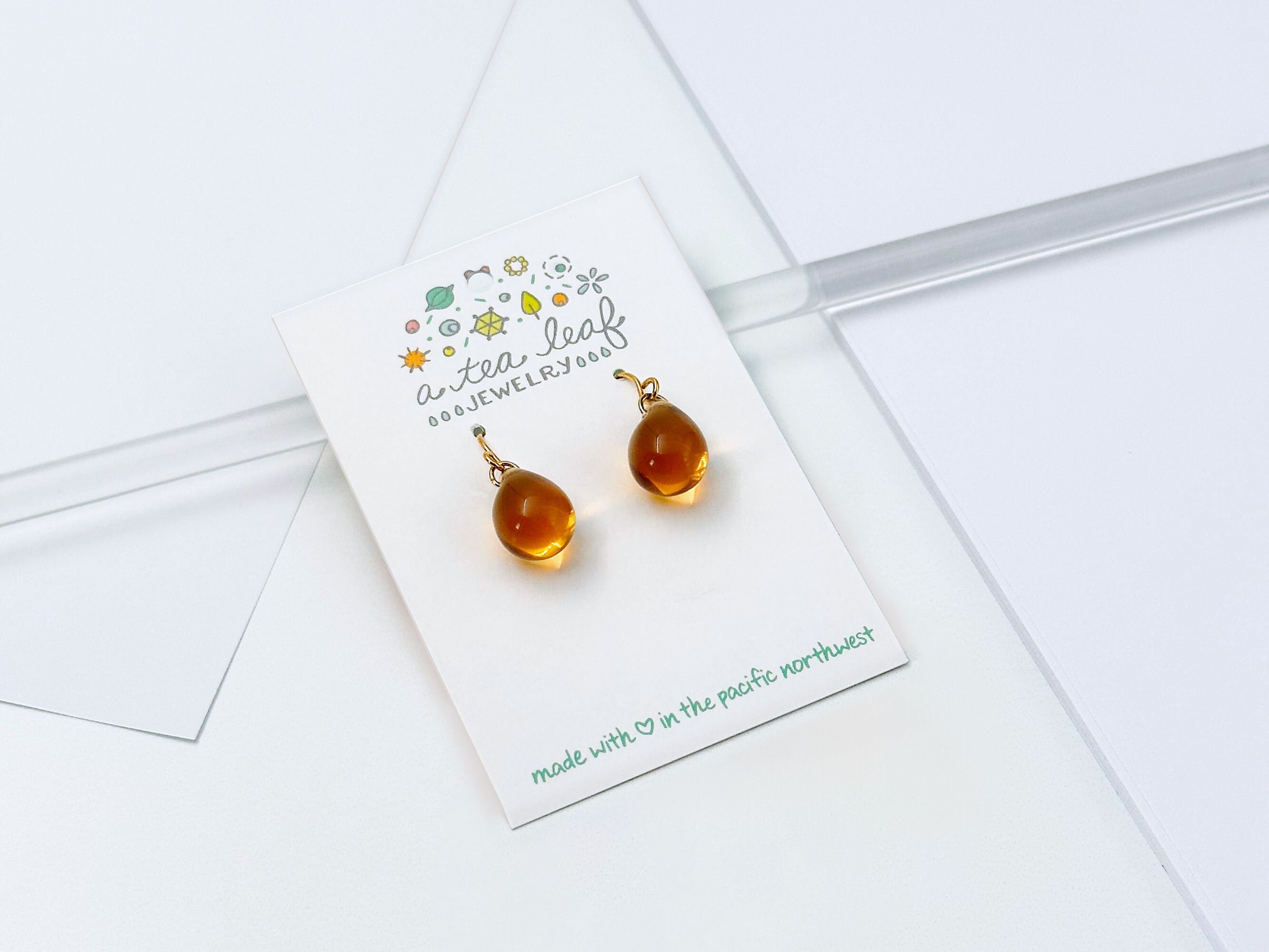 Tea Leaf Charm Huggie Earrings Tea Leaf Charm Huggie Earrings