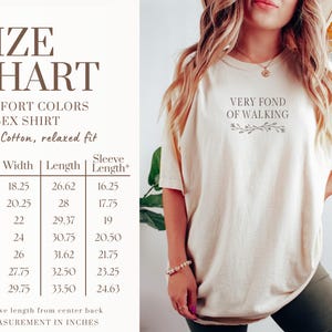 May include: Ivory unisex t-shirt with the text "VERY FOND OF WALKING" and a floral design. The size chart shows measurements in inches for width, length, and sleeve length. Made of 100% cotton.