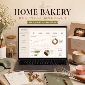 May include: A laptop displaying a Home Bakery Business Manager Excel workbook dashboard with charts and financial data. Surrounding items include a recipe notepad, gold measuring spoons, a wire whisk, a notebook, a coffee cup, and bakery boxes.