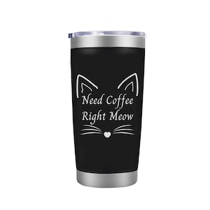 May include: Black stainless steel tumbler with a white cat face and the text "Need Coffee Right Meow".