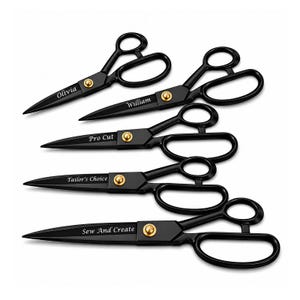 May include: A set of four black metal scissors with gold-toned pivot screws. Each pair features a unique engraved name or phrase on the blade: Olivia, William, Pro Cut, Tailor's Choice, and Sew And Create. The scissors have ergonomic handles.