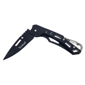 May include: Black folding pocket knife with a silver carabiner clip. The blade is partially open, revealing the text "Wahab" etched on the blade. The knife has a sleek, modern design, suitable for everyday carry or outdoor use.