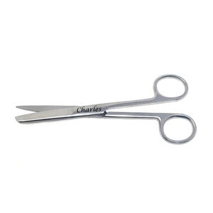 May include: Stainless steel surgical scissors with curved blades and finger ring handles. The word "Charles" is engraved on the scissors. The scissors are designed for precision cutting in medical or surgical procedures.