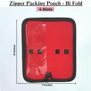 May include: Bi-fold zipper packing pouch with 4 slots. The interior is red, with a clear plastic pocket and black elastic bands. The pouch is 7 inches wide and 8 inches tall. The exterior has a black zipper and trim. The text "Zipper Packing Pouch - Bi Fold" is at the top.