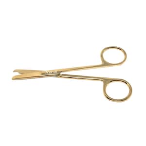 May include: Gold-colored surgical scissors with ring handles. The scissors have a curved blade and a small notch near the tip. The word "Nyrah" is printed on the scissors.