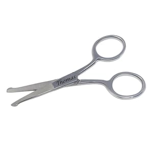 May include: Small, silver scissors with rounded finger holes. The word "Thomas" is engraved on the blade. These scissors are designed for precision cutting.