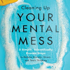 May include: Book cover with a blue background and white foam. The title is "Cleaning Up Your Mental Mess" with the subtitle "5 Simple, Scientifically Proven Steps to Reduce Anxiety, Stress, and Toxic Thinking". The author is Dr. Caroline Leaf.