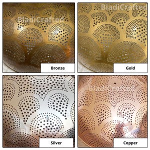 May include: A collection of four metal bowl surfaces featuring a repeating fan-shaped pattern of perforated holes. The finishes include bronze, gold, silver, and copper tones, each labeled with its respective color name in the image.