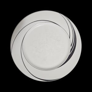 May include: White ceramic plate with a black swirl design. The plate has a wide rim and a central area with a subtle textured pattern. The black lines create a dynamic, curved pattern on the plate's surface. This plate is suitable for serving food.