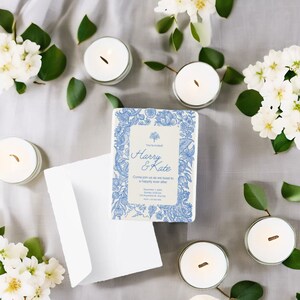 May include: A white wedding invitation with a blue floral border. The invitation reads "You're Invited" and "Harry & Kate". The text also says "Come join us as we toast to a happily ever after".