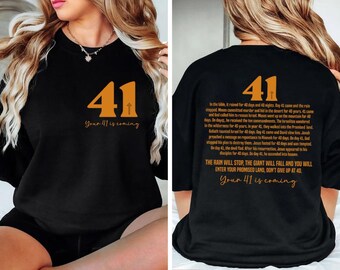May include: Black t-shirt with an orange number 41 and the text "Your 41 is coming". The back of the shirt has a longer text about the number 41 in the bible.