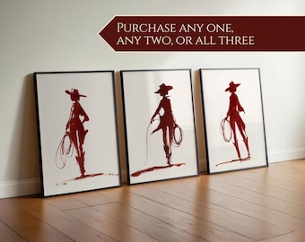 May include: Three framed art prints featuring a red silhouette of a person in a cowboy hat and boots, holding a lasso. The prints are displayed against a white wall and a wooden floor. Text at the top reads: PURCHASE ANY ONE, ANY TWO, OR ALL THREE.