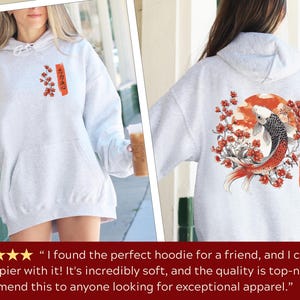 Ash color Japanese Koi Fish Hoodie with a back & front print, featuring vintage Asian artwork & the Japanese cultural symbols of the Koi Fish, cherry blossoms, the Japanese sun & Kanji writing, with the symbols for Loyalty, Strength & Determination.