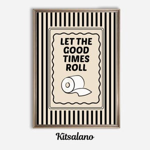 May include: Framed wall art with a black and white striped background. The artwork features a cream-colored rectangle with the text "LET THE GOOD TIMES ROLL" and a toilet paper roll illustration. The artist's name, Kitsalano, is at the bottom.