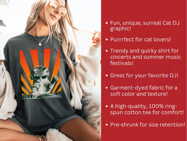 May include: Dark gray t-shirt featuring a cat DJ graphic with sunglasses and headphones, set against an orange and yellow sunburst design. The text on the shirt says "Fun, unique, surreal Cat DJ graphic!"