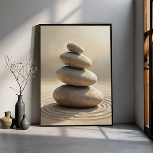 Puede incluir: Impresión enmarcada que presenta una pila de cuatro piedras lisas de color beige. Las piedras están equilibradas sobre un fondo suave y neutro. La obra de arte evoca una sensación de tranquilidad y equilibrio, adecuada para la decoración del hogar.
