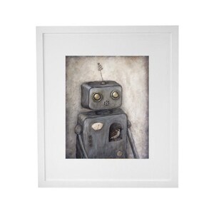 May include: A framed illustration of a gray robot with a small bird inside its chest cavity. The robot has a small antenna on its head and large, round, yellow eyes. The background is a light brown color.