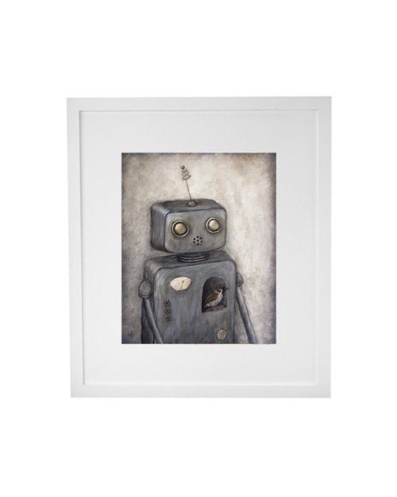 May include: A framed illustration of a gray robot with a small bird inside its chest cavity. The robot has a small antenna on its head and large, round, yellow eyes. The background is a light brown color.
