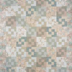 May include: A patchwork quilt in a neutral color palette of beige, sage green, and light blue. The quilt features a repeating block pattern with a floral border. The design is a mix of solid and patterned fabrics, creating a textured and visually appealing textile.