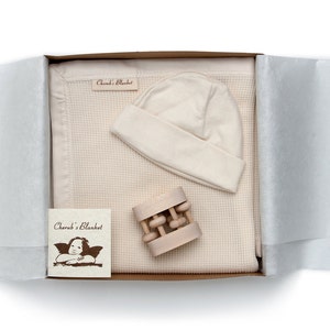 Best Baby Shower Gift Set - Finest Quality Organic Cotton Blanket with Baby Hat and Heirloom Rattle