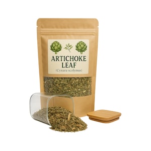 May include: A brown paper bag with a label that reads "Artichoke Leaf (Cynara scolymus)". The label has a drawing of two artichokes. The bag is filled with dried artichoke leaves. A glass jar with a bamboo lid is spilling dried artichoke leaves onto a white surface.