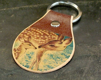 Deer keychain on leather