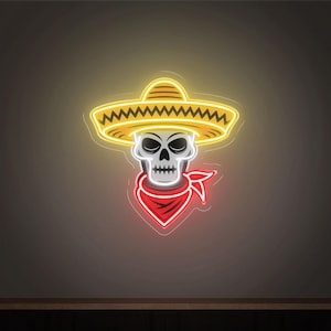 May include: Neon sign featuring a skull wearing a yellow sombrero and a red bandana. The skull has a white face with black eyes and teeth. The sign is illuminated with a bright neon glow, perfect for a bar or restaurant.