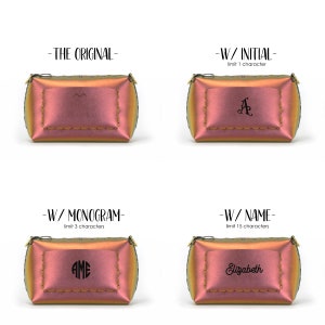 May include: Four iridescent pink and gold cosmetic bags with different personalisation options. The first bag is blank. The second bag has the initial "A" on it. The third bag has the monogram "AME" on it. The fourth bag has the name "Elizabeth" on it.