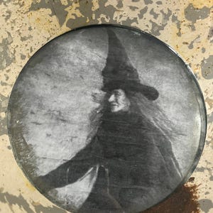 Halloween Decor: Black & White Witch Picture in Pressed Metal Circular Frame