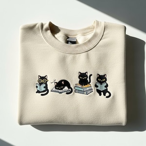 Black Cat Embroidered Sweatshirt, Book Lover Crewneck, Bookish Cat Reading Hoodie, Cozy Bookworm Tee, Animal Lover T-Shirt For Women