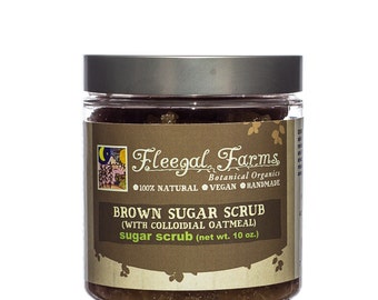 May include: A brown glass jar with a silver lid filled with brown sugar scrub. The label reads "Fleegal Farms, Botanical Organics, 100% Natural, Vegan, Handmade, Brown Sugar Scrub (with colloidal oatmeal), sugar scrub (net wt. 10 oz.)"