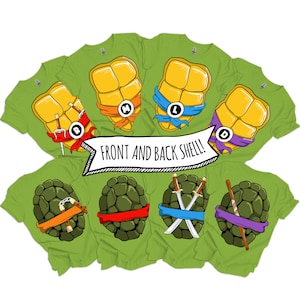 May include: A collection of light green t-shirts featuring graphic prints of turtle shells. The top row shows yellow plastron shells with coloured masks and letters, while the bottom row displays dark green carapace shells with various weapons.