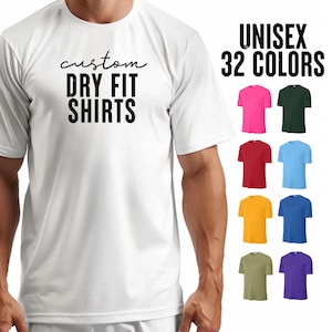 May include: White t-shirt with the text "custom dry fit shirts" printed on the front. Unisex t-shirt available in 32 colors.