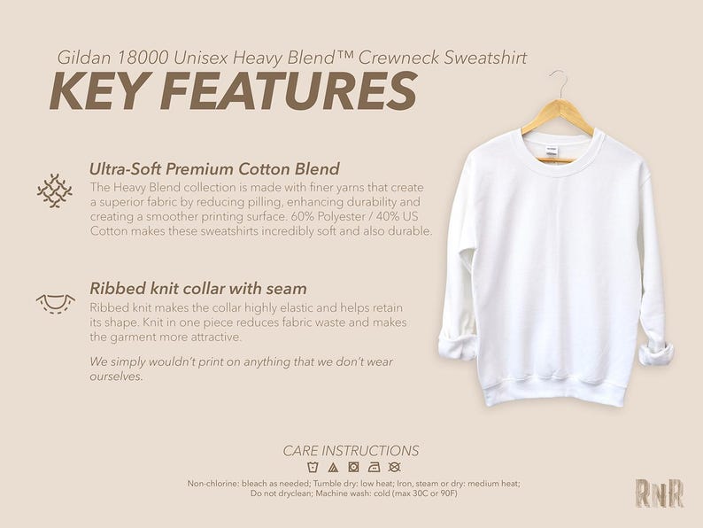 May include: A plain white Gildan crewneck sweatshirt on a wooden hanger. The sweatshirt has a ribbed knit collar and is made from a soft cotton blend. The image includes text detailing key features and care instructions.