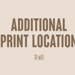 May include: A brown text graphic on a beige background that reads "ADDITIONAL PRINT LOCATION" with the letters "RNR" below the text.