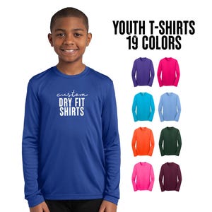 May include: A young person wearing a blue long-sleeve Dry Fit shirt. The shirt has white text that says "custom DRY FIT SHIRTS". The image also shows a variety of long-sleeve shirts in 19 colors.
